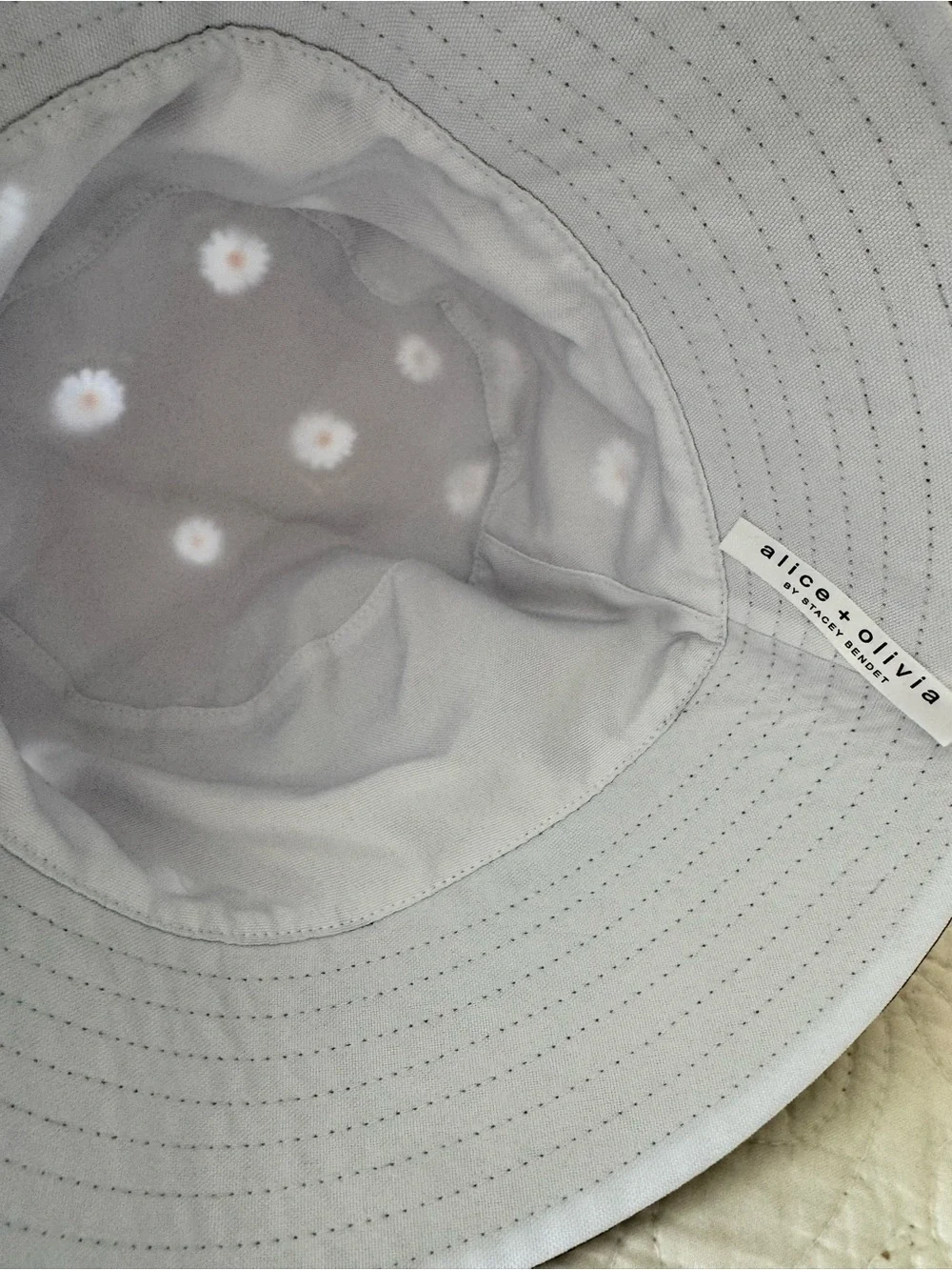 Alice + Olivia Reversible Black Daisy Bucket Hat with White Blossoms